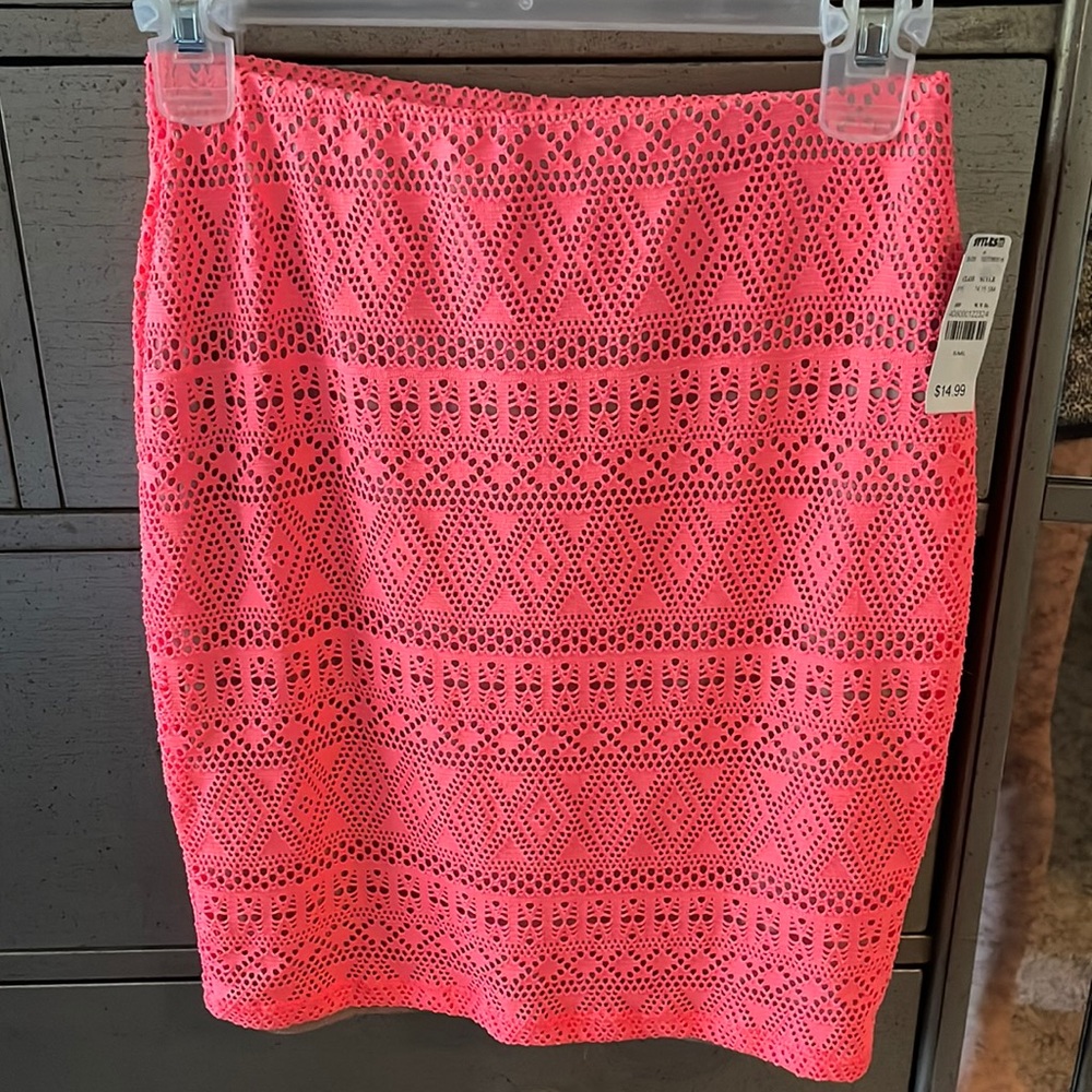 Brand NEW pink skirt with tags. Size small. 19 inches long